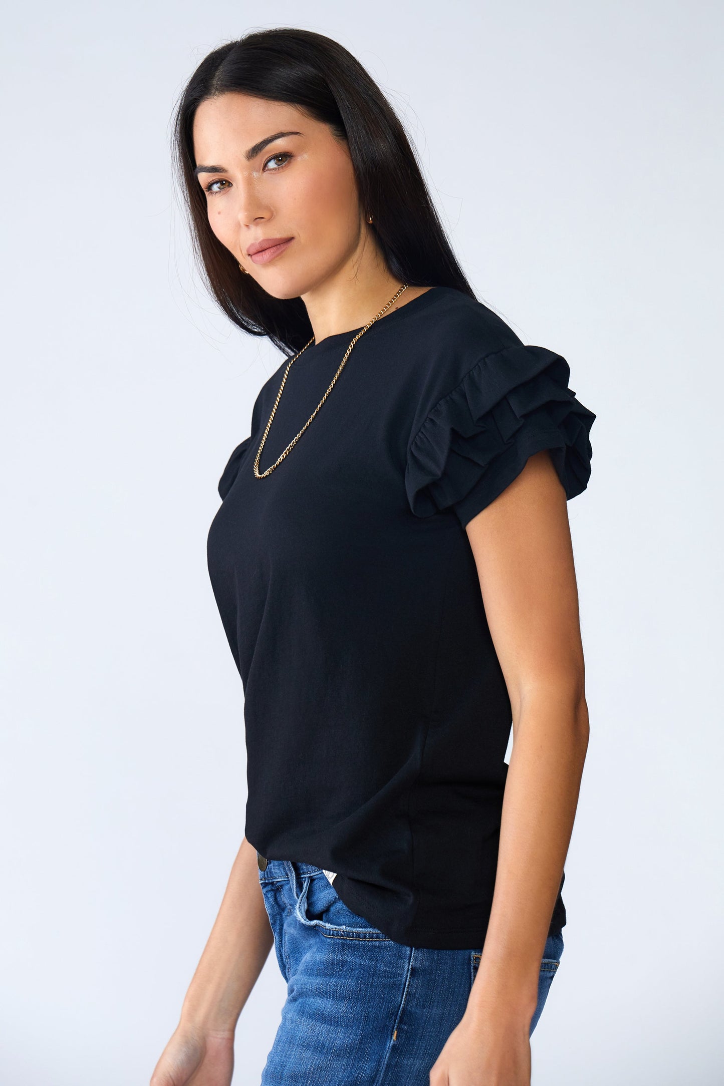 Woman wearing Ella Ruffle Sleeve Tee with double ruffle short sleeves and relaxed fit in organic cotton