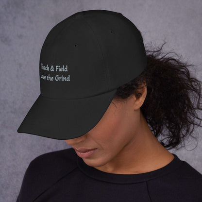Low-profile Track and Field hat with green camo, adjustable strap, and curved visor