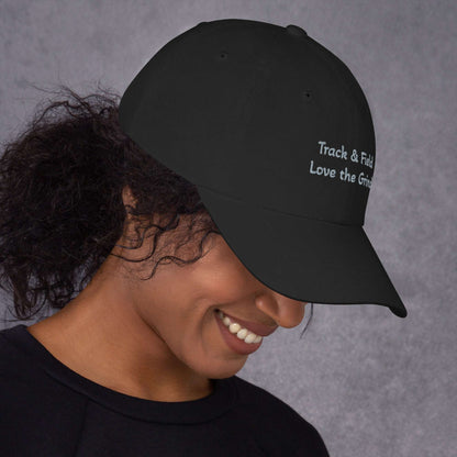 Low-profile Track and Field hat in green camo with adjustable strap and curved visor