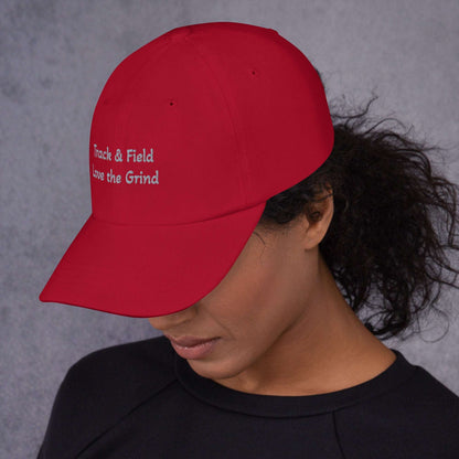 Track and Field hat with green camo low-profile design and adjustable strap