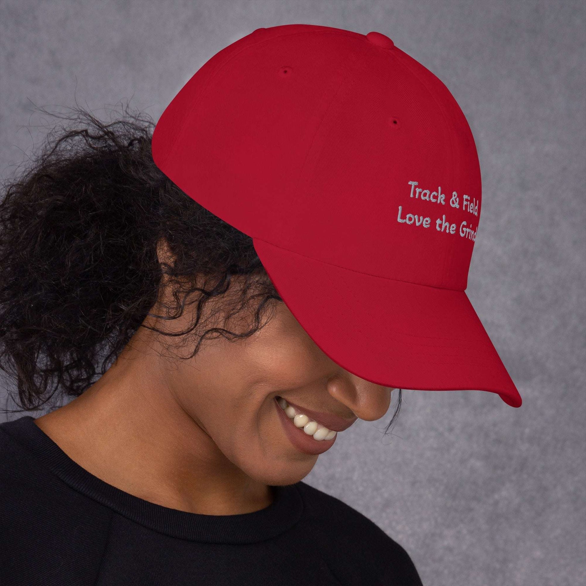 Low-profile Track and Field hat with adjustable strap and curved visor in green camo color