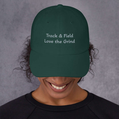 Green camo Track and Field hat with low profile, adjustable strap, and curved visor