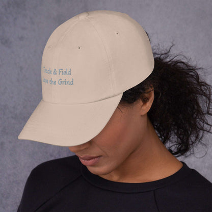 Green camo Track and Field hat with low profile, adjustable strap, and curved visor made from chino cotton twill