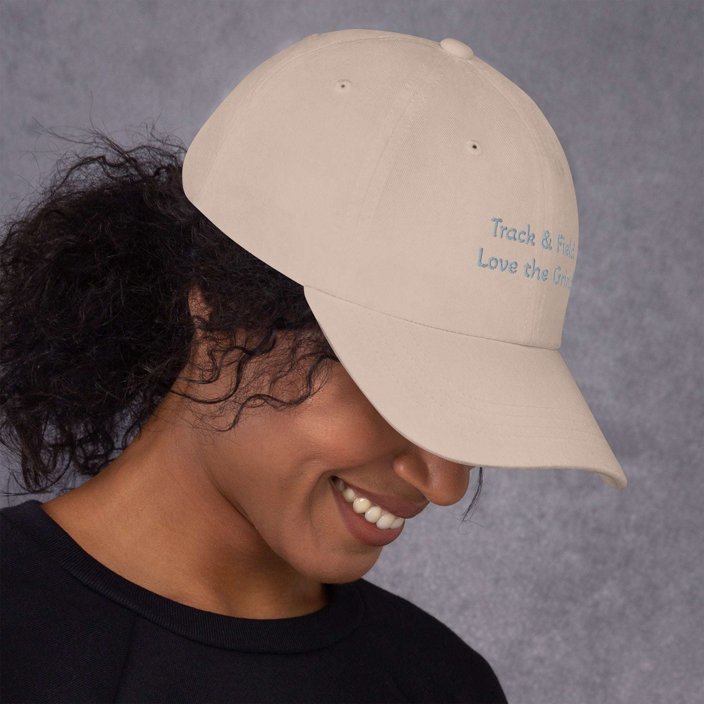 Green camo Track and Field hat with adjustable strap and curved visor