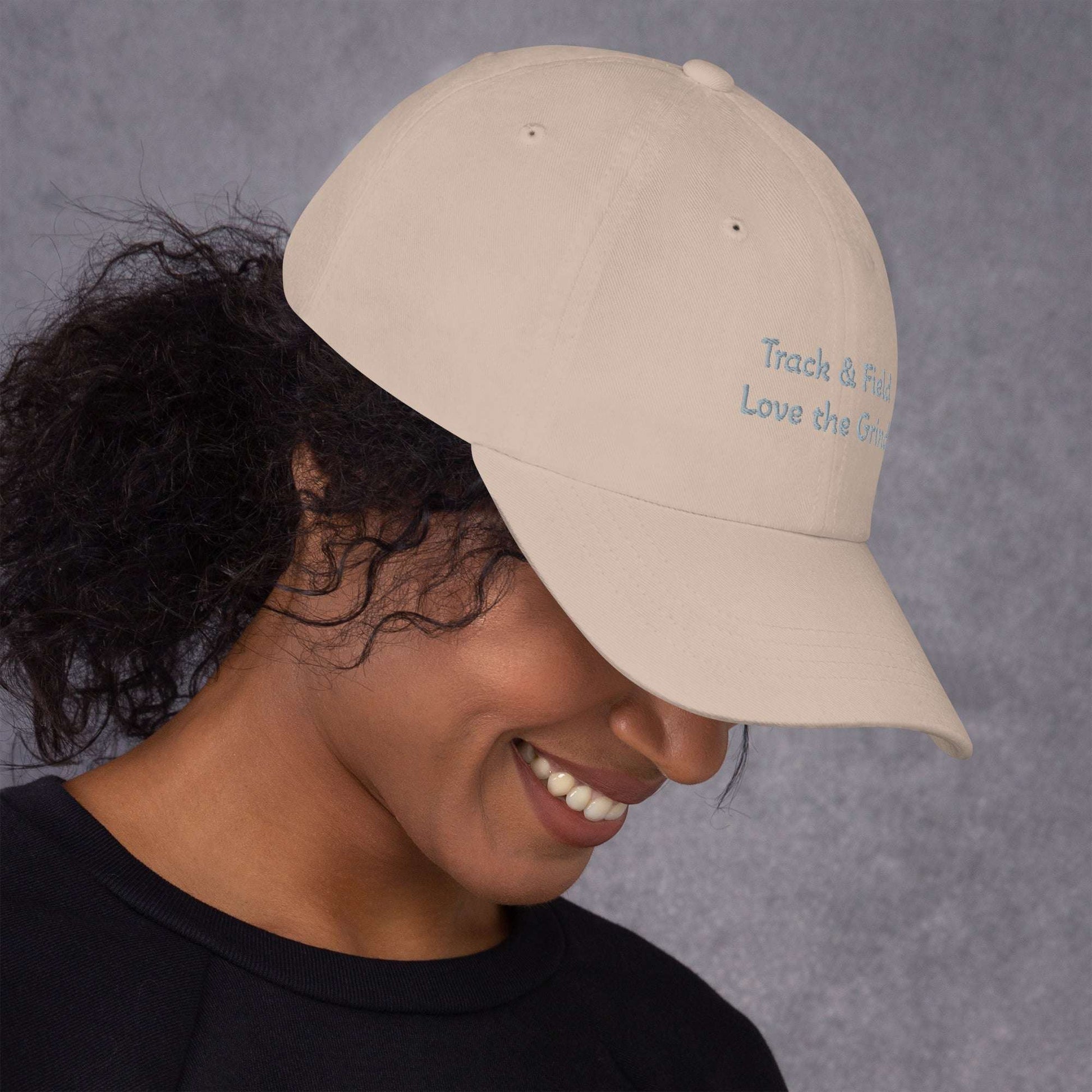 Green camo Track and Field hat with adjustable strap and curved visor