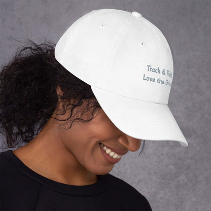 Green camo Track and Field hat with low profile, adjustable strap, and curved visor made of chino cotton twill